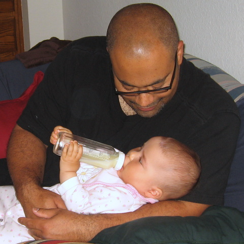 Ari holding her own bottle